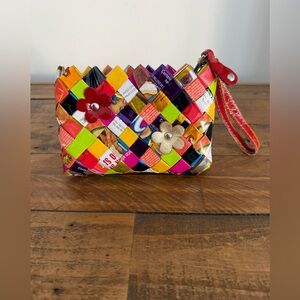 Nahui Ollin Multicolor Woven Clutch with Floral Accents